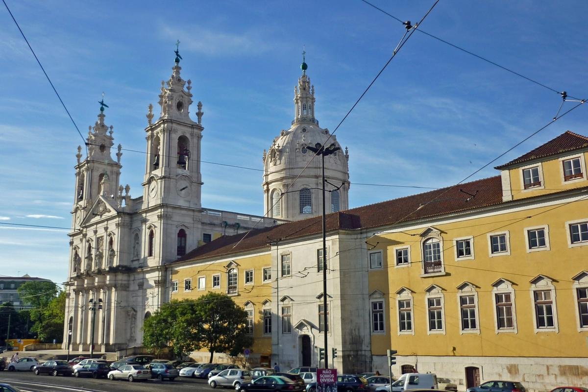 The Basílica da Estrela and a yellow apartment building in the Estrela neighbourhood of Lisbon, Portugal, a residential area D7 movers settle in